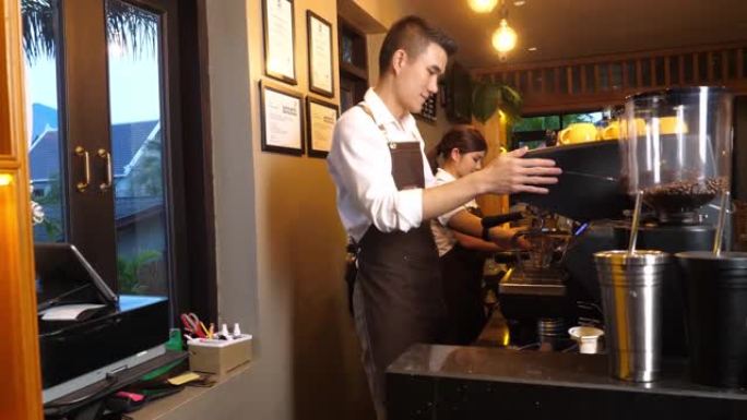 亚洲咖啡师准备咖啡工作订单