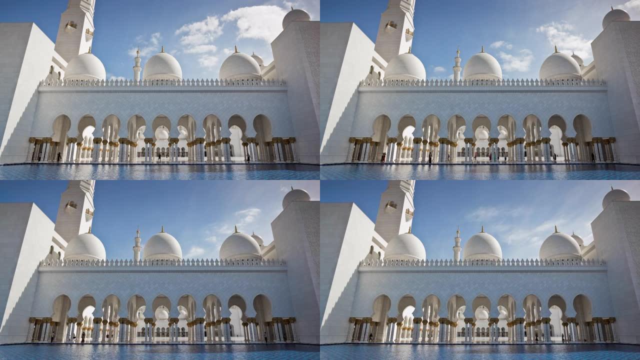 著名的晴天阿布扎比大清真寺白色前厅水上全景4k延时阿联酋