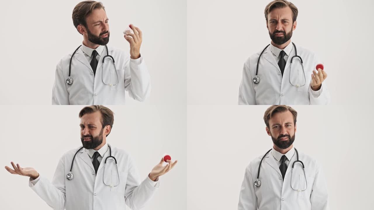 困惑的男人医生用听诊器看着药瓶，用手打手势