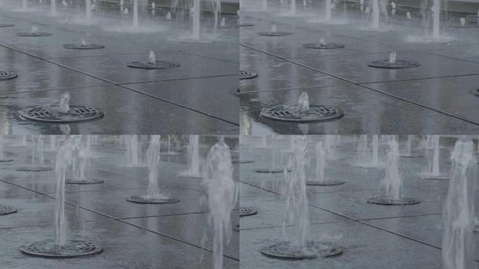 上喷泉的特写镜头。水在4k超高清中喷出并落下
