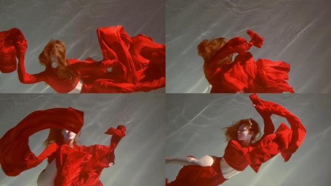 一个美丽的红发年轻女子，她周围漂浮着鲜艳的红色织物，在水下