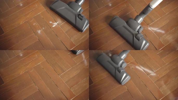 使用真空吸尘器清洁木地板上的灰尘