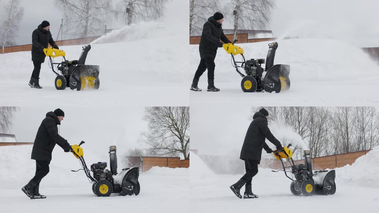 一名男子在院子里用吹雪机在慢动作降雪时清理积雪。前视图。慢动作