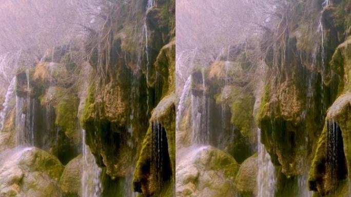 河源来自从山上掉下来的瀑布的过滤水。4k垂直镜头