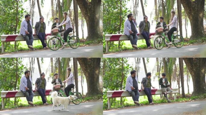 女人骑自行车回家时停下来问候她的朋友。
