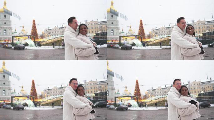 在基辅圣诞树的背景上拥抱情侣