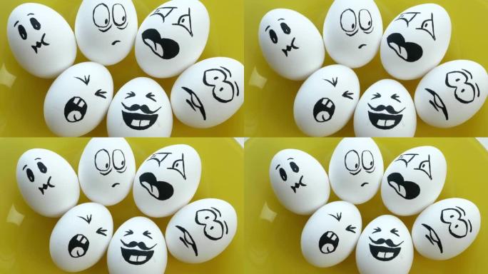在黄色盘子上煮了白色的鸡蛋，带有有趣的情感面孔。恐惧，愤怒，蔑视，笑声，喜悦，惊讶，烦恼。复活节
