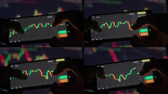 投资者在智能手机屏幕上查看比特币图表