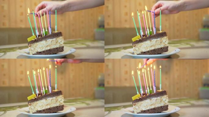 一只女性的手在一块生日巧克力蛋糕上点燃了九支蜡烛。4K