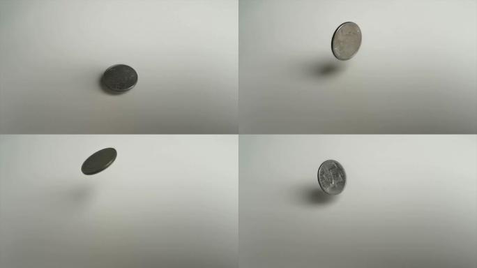 四分之一美元，25美分硬币，旋转白色背景1000 fps超慢动作视频