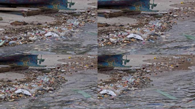 人们在海滩上扔的海洋垃圾会毒害海水