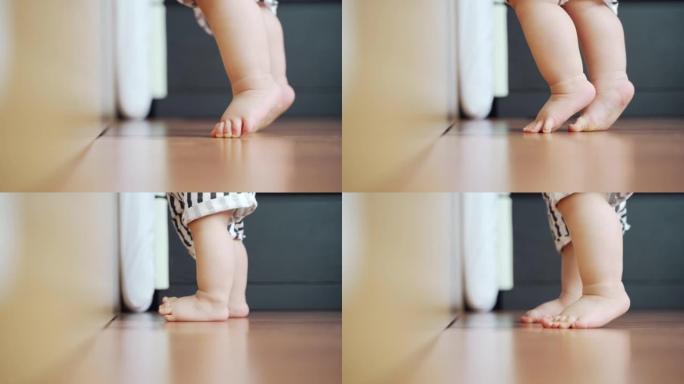 蹒跚学步的小孩踮起脚尖，婴儿的脚。