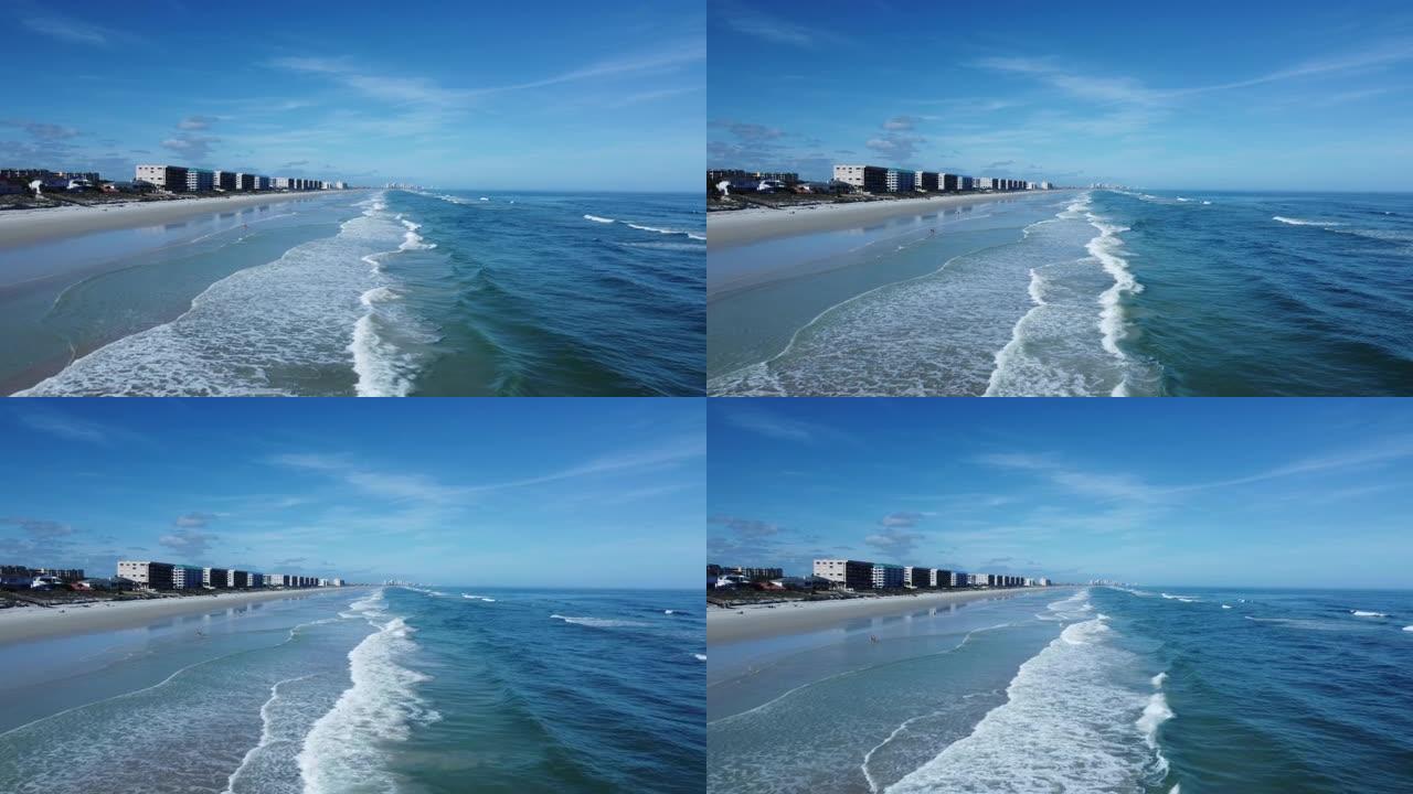 在阳光明媚的佛罗里达飞越美丽的蓝色水和闪闪发光的沙滩