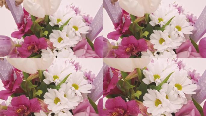 白色和粉红色的鲜花花束特写。玫瑰、雏菊和观赏植物的装饰，特写，选择性聚焦，没有人，物体
