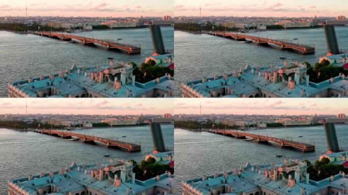 涅瓦河上离婚的三一大桥的航拍视频，一年一度的庆祝传统节日的学生猩红色的航行在俄罗斯，圣彼得堡