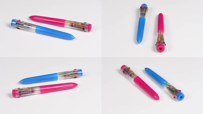 白色上有两支彩色笔芯的钢笔。十种不同的颜色。侧视图。循环运动。旋转360。
