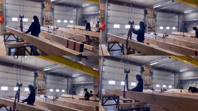 木工车间修剪木梁，用于生态自建房屋结构