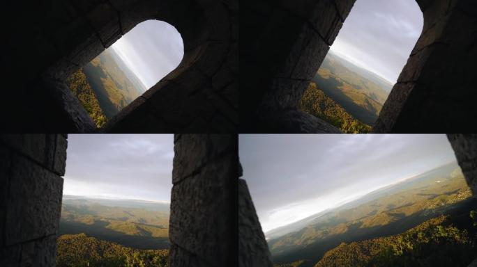 相机飞过一座古塔的跨度，展示着山脉的风景。非常漂亮的镜头