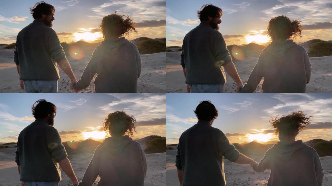 浪漫的男女情侣，在户外休闲活动中互相欣赏彩色日落。旅行和令人惊叹的目的地的概念。恋爱中的情侣和太阳