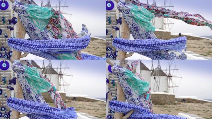 希腊米科诺斯岛的传统风车和在风中飘扬的头巾