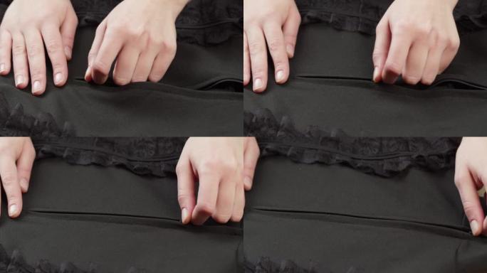 用蕾丝guipure特写手拉黑色衬衫。裁缝服装概念。手工制作的东西，制衣，纺织品样品的宏观拍摄