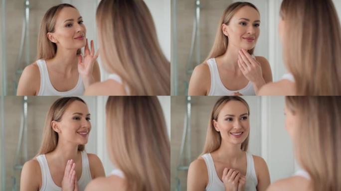 年轻女子早上在镜子里看着自己。用8k的红氦相机拍摄。