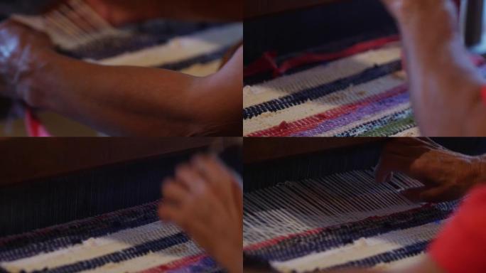 旧织布机的细节工作并制作破布的门垫的女人