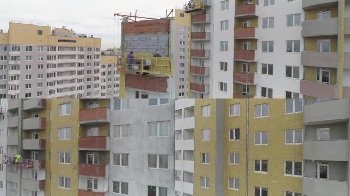 多层公寓楼立面升降机保温抹灰的建筑商