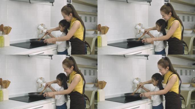 年轻女孩在家帮助母亲做饭