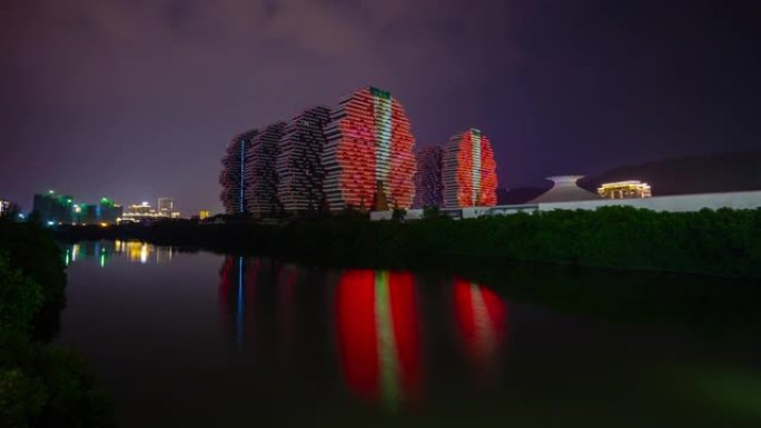 三亚市夜景照明著名酒店河滨湾反射全景4k延时海南岛中国