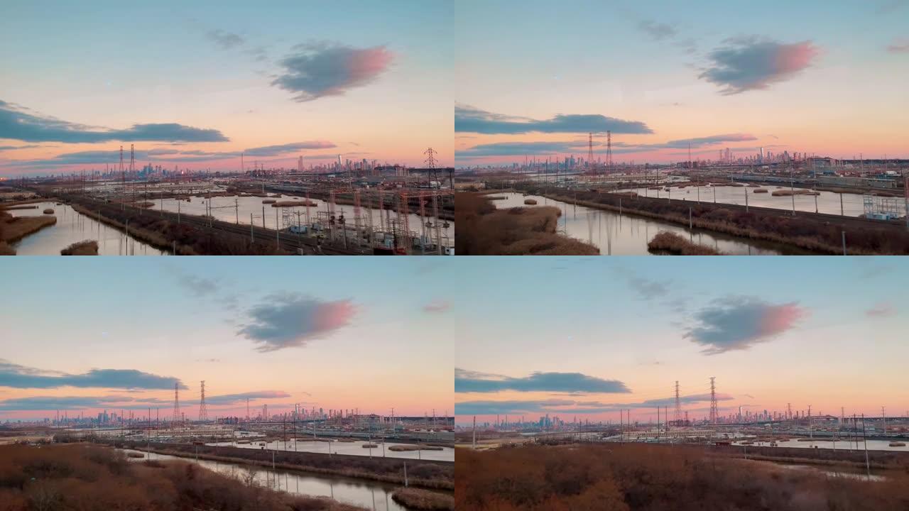 日落时火车内的城市摩天大楼的平移镜头