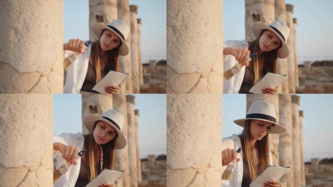 考古学家站在古庙的废墟中。女人手里拿着刷子挖掘和地图。一个古老寺庙里的女孩，柱子看着地图记录。考古挖