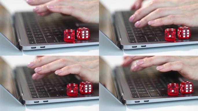 女人手在笔记本电脑键盘上打字骰子特写4k电影