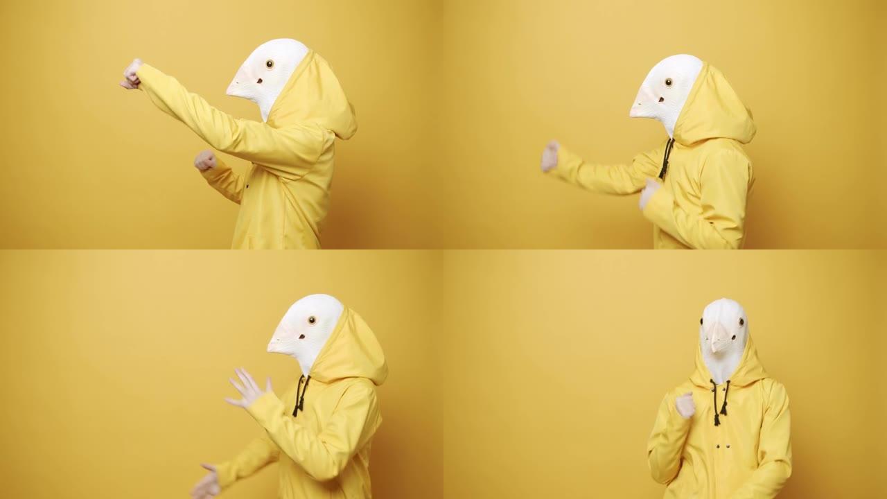 快乐的家伙喜欢在黄色背景上戴着鸽子面具跳舞。愚人节。