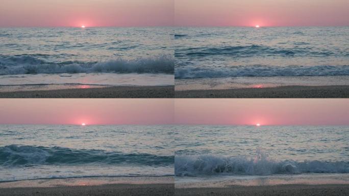 浪漫的海洋日落背景。紫色的地平线天空没有云层和波浪朝向卵石滩