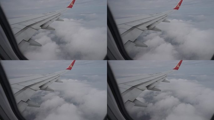 在云层上飞行的民航飞机