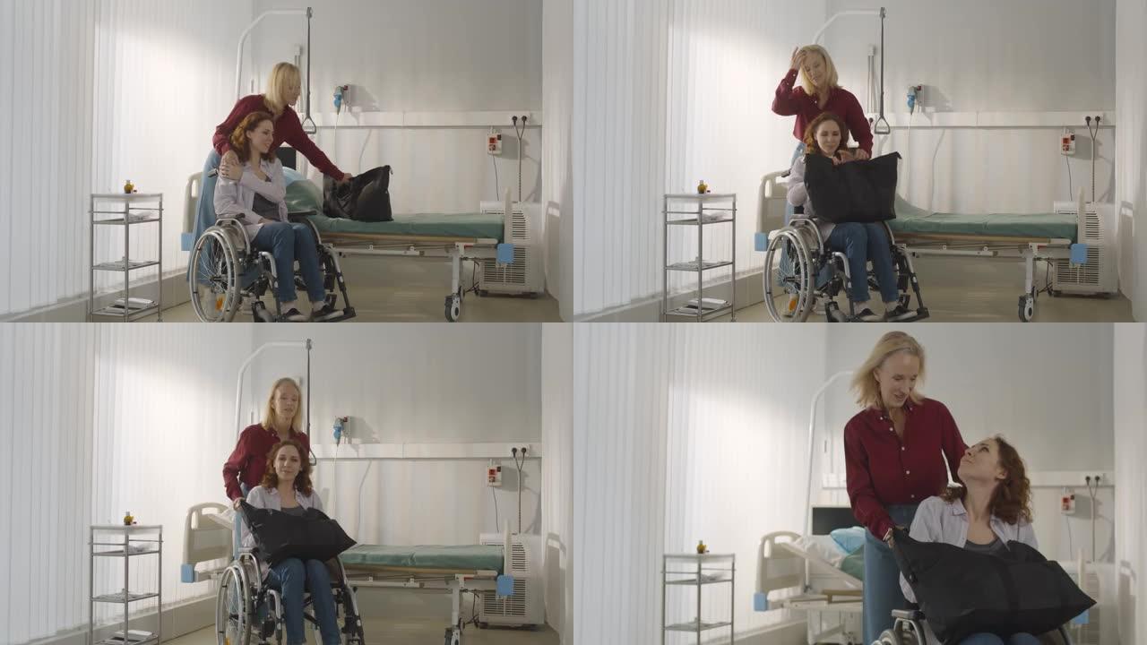 老年妇女推着轮椅与女儿出院