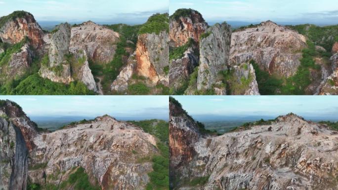 宋卡府奇怪形状山Khao Kuha的空中无人机日出场景。有绿色林木的山。泰国的自然景观背景。黄山。