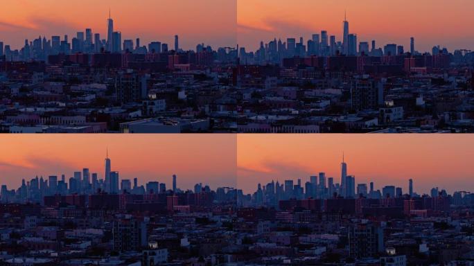 曼哈顿市中心和自由塔在日落时分，映衬在色彩缤纷的戏剧性天空下。日落时分，布鲁克林住宅区的远景。无人机