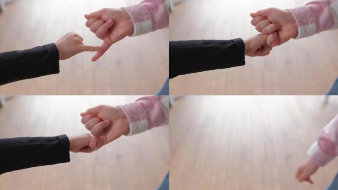 高加索孩子用手指做粉红色的发誓承诺手势