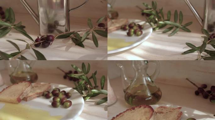 静水生活一盘橄榄油和面包。特写。桌子上的绿色树枝。