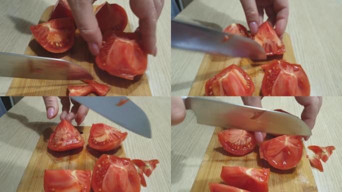 家庭主妇用木板上的刀切有机番茄