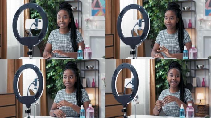 一位受欢迎的有影响力的vlogger在社交媒体上创建了一个视频，该视频与设置在环形灯架上的电话交谈，