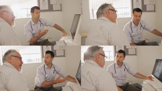 男医生在医生办公室的计算机上与高级患者交谈