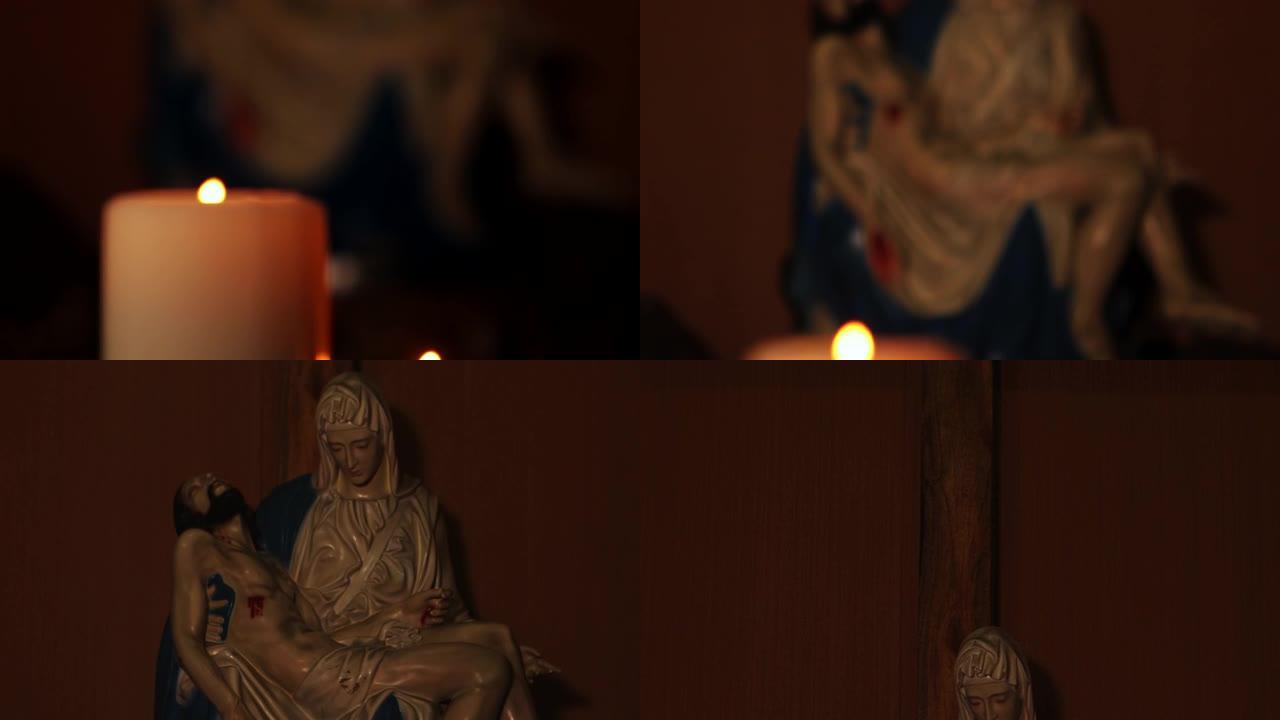 2017年3月13日，雅加达: 蜡烛点燃，背景上有一个Pieta雕像和一个大十字符号