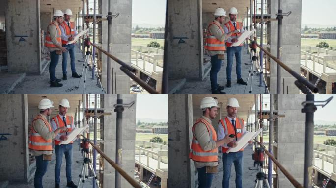 4k录像，两名男子在建筑工地上一起工作时看着建筑平面图