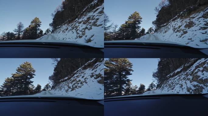 在崎岖雪地山路上行驶的汽车第一视觉