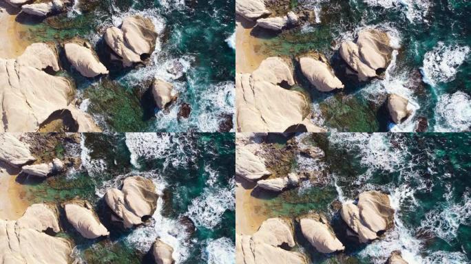 自然，岩石海岸的海浪，水的纹理，对海洋的鸟瞰图，塞浦路斯