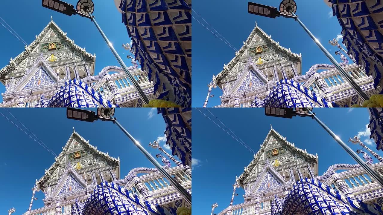 带发光二极管灯柱的蓝色陶瓷泰国寺庙的延时视频。