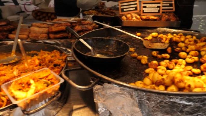 巴黎街头食品市场布局即食餐土豆和肉类、米饭等